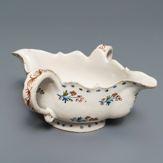 A polychrome Brussels faience 'à la haie fleurie' sauce boat, 18th C.